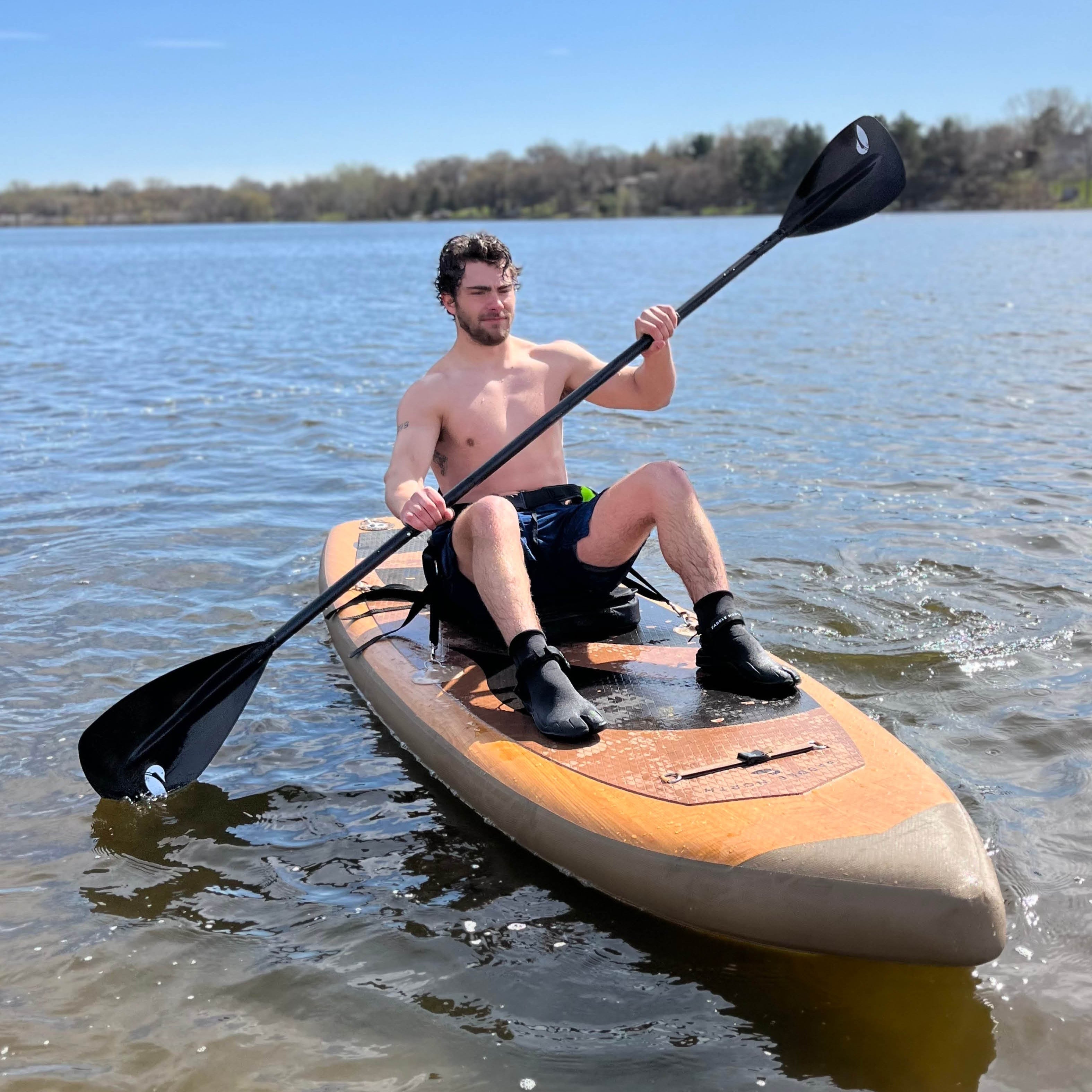 paddling a paddle board with a kayak seat
