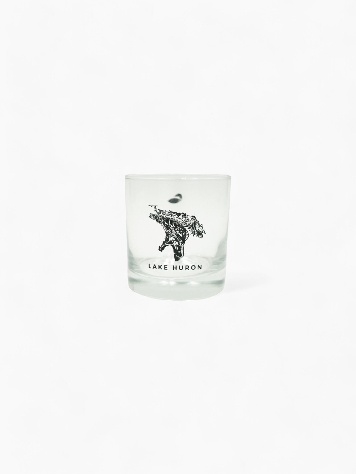 Glass with Lake Huron printed on it.