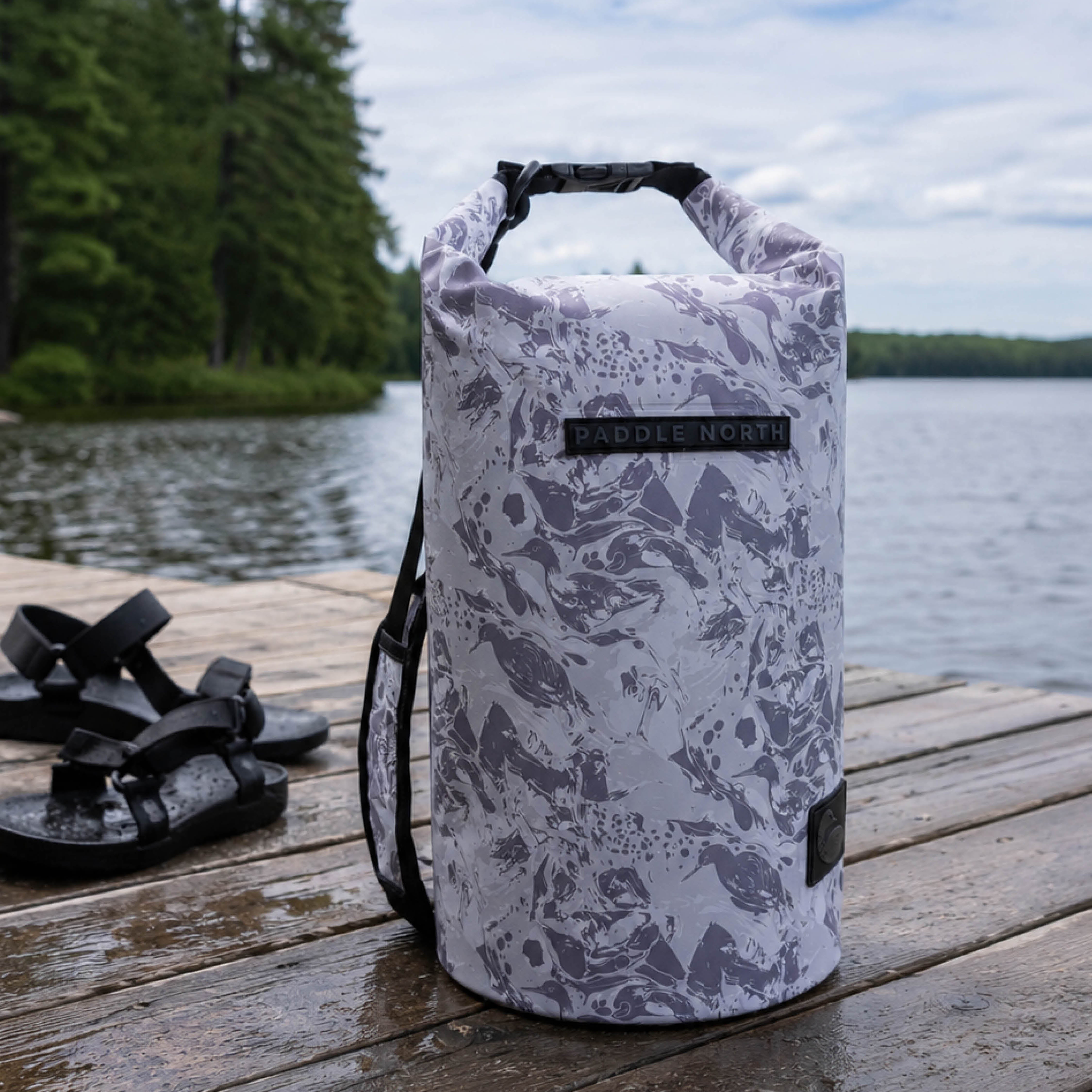 15 liter waterproof dry bag on a dock next to a lake