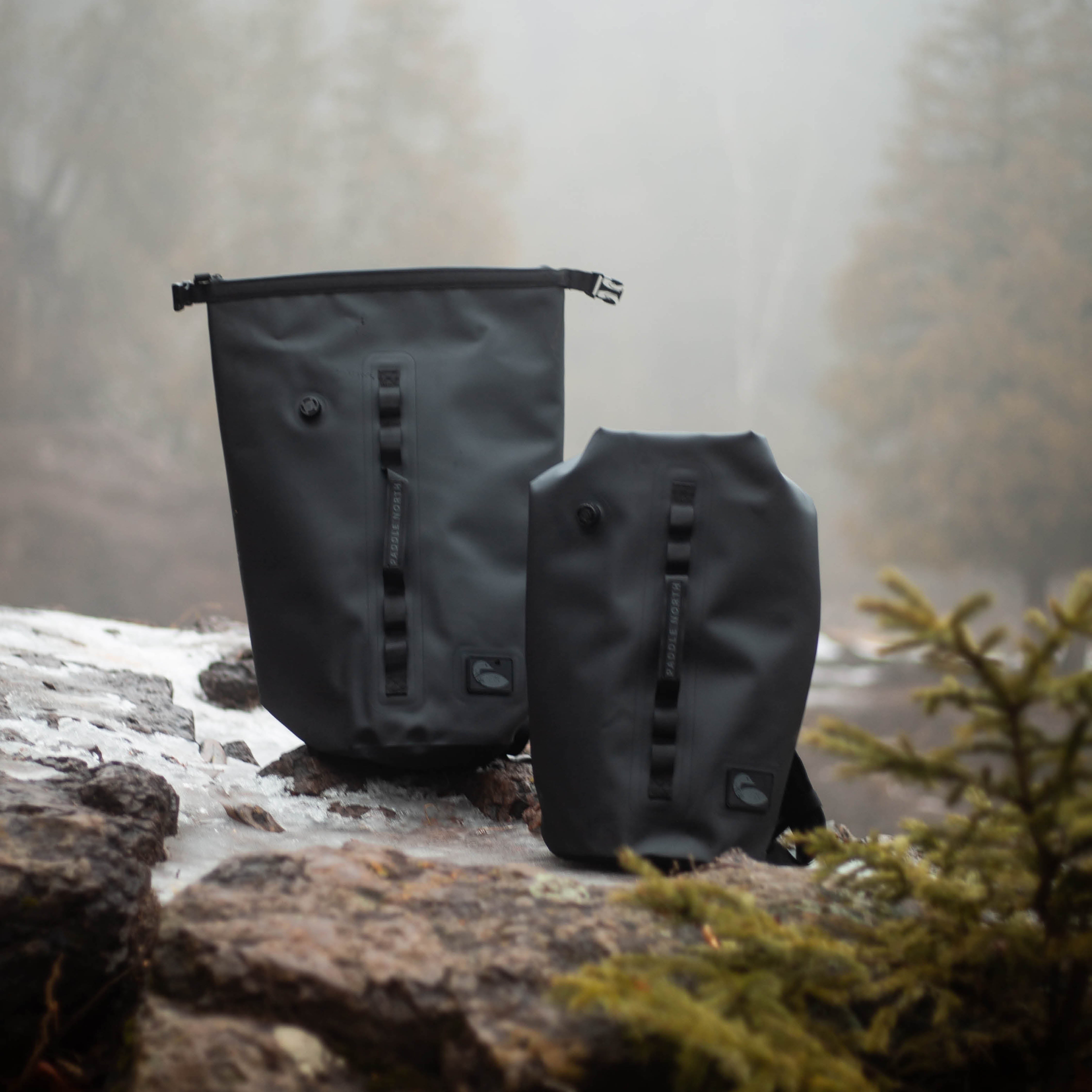Waterproof dry cooler backpack next to a waterfall on a hiking trail