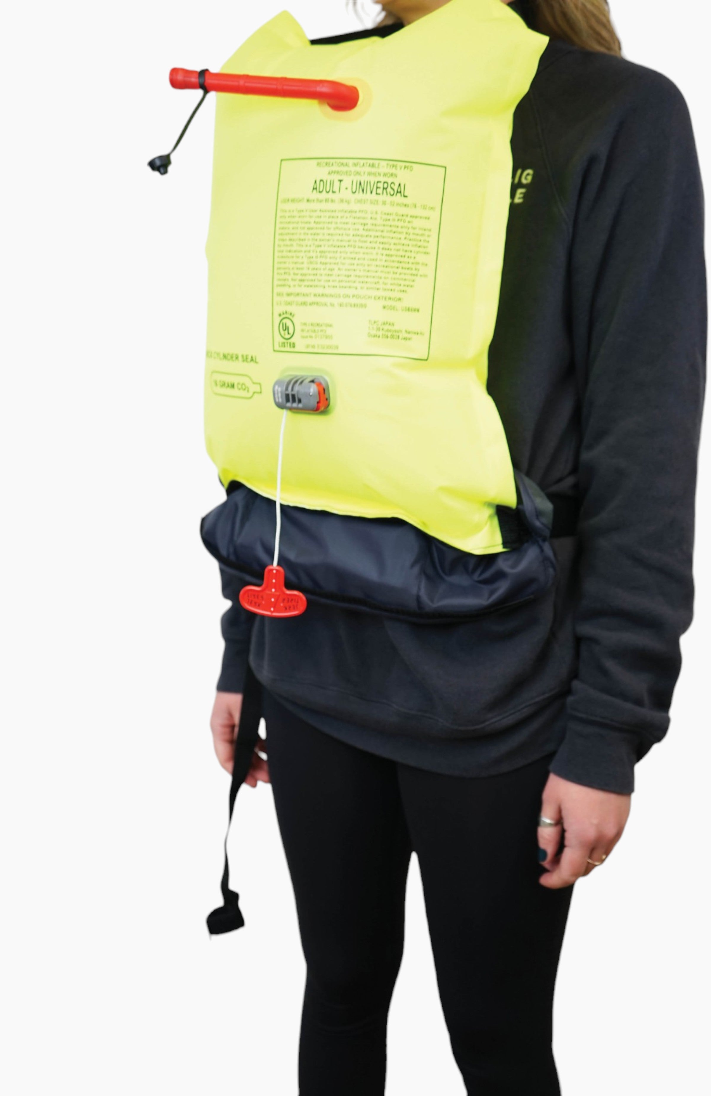 Water accessories: woman wearing an inflatable life jacket.