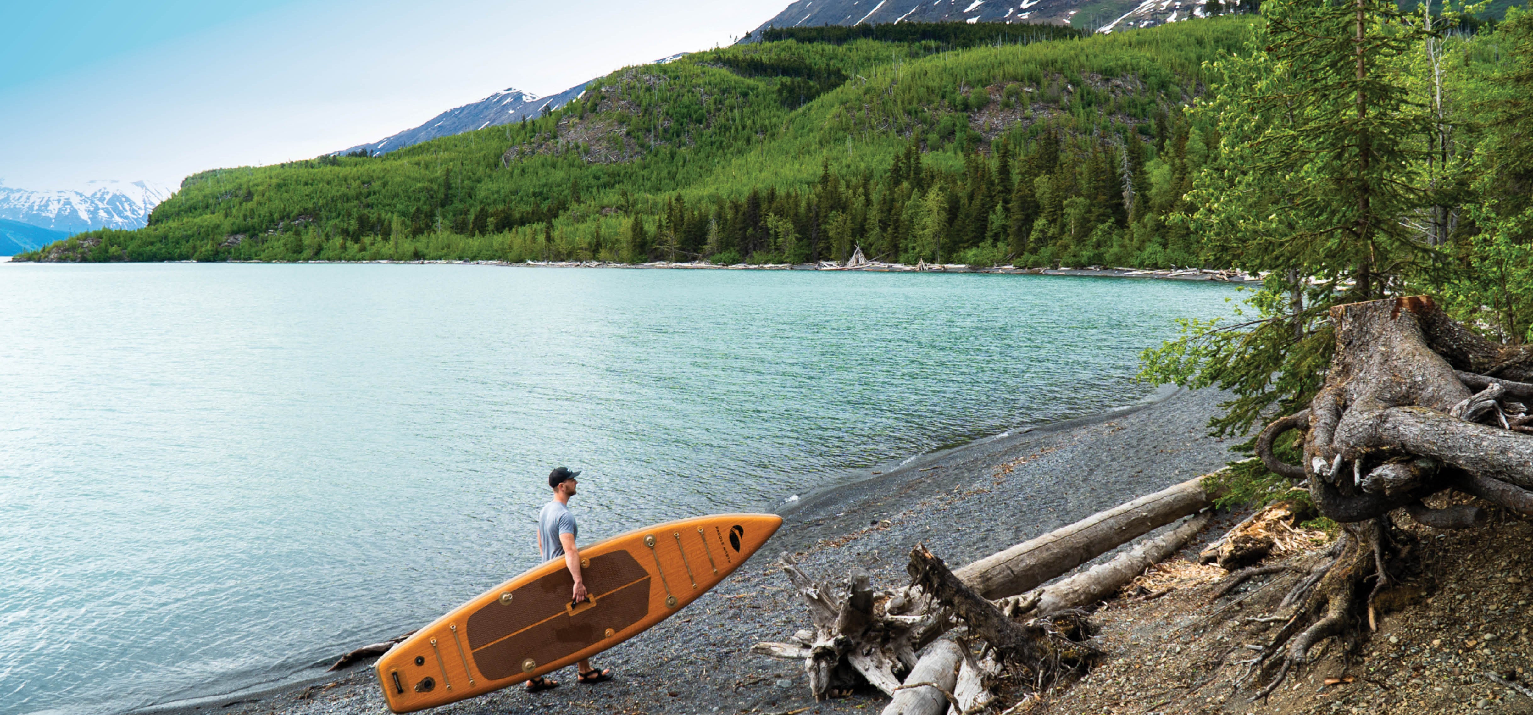 Inflatable paddle board near the mountains