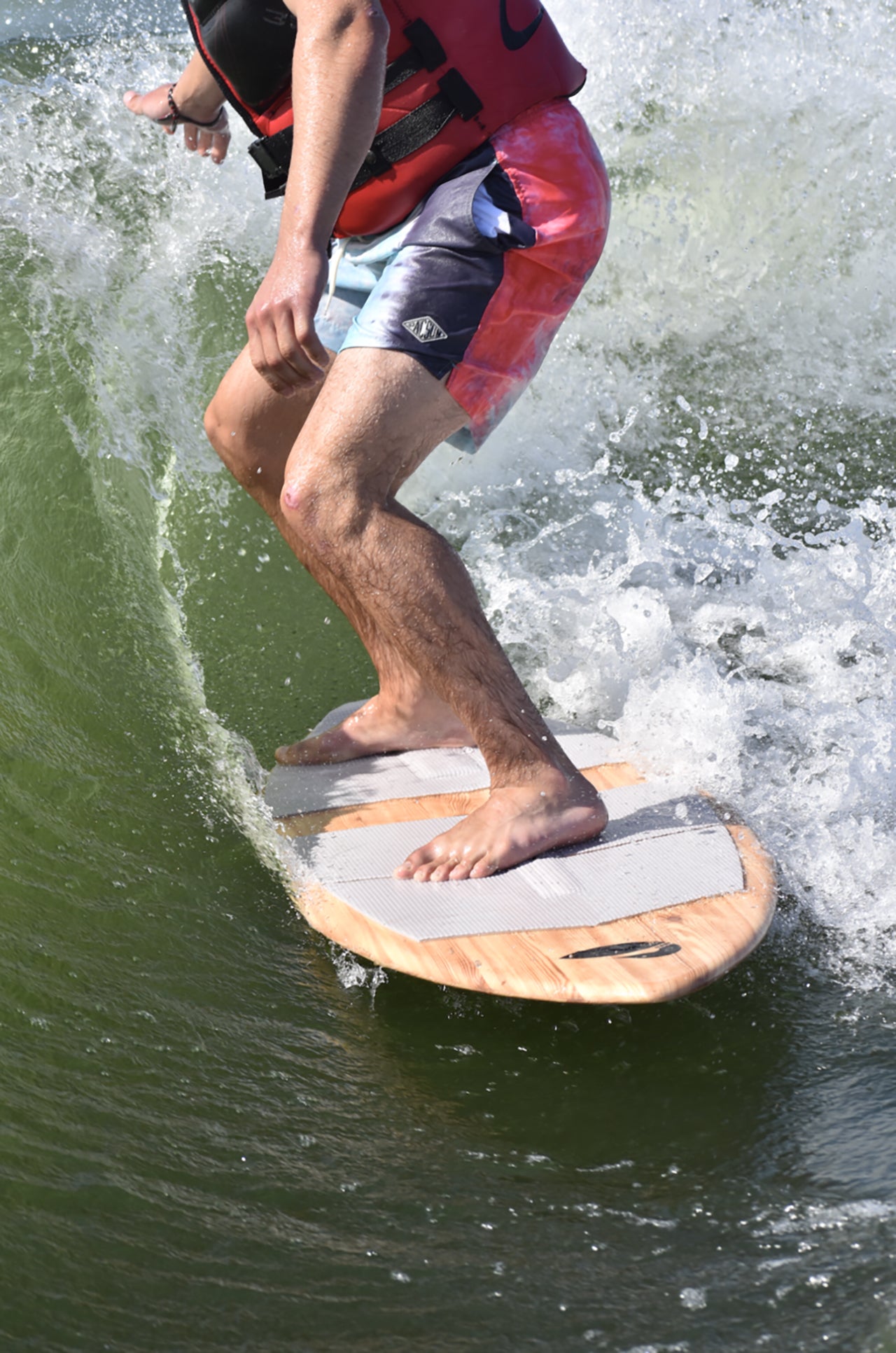 Person using a lake surfer in the water.