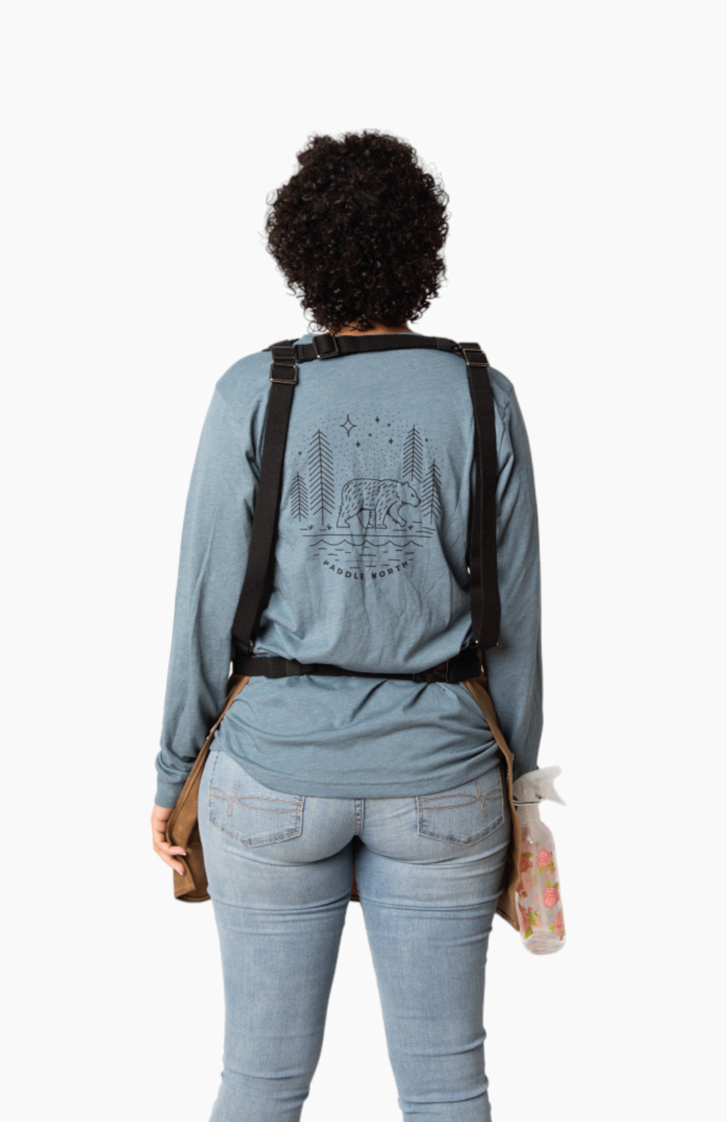 Photo of the back of a person wearing an apron.