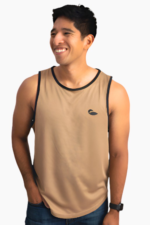 Person wearing a tan athletic tank top with black piping around arms and neck.