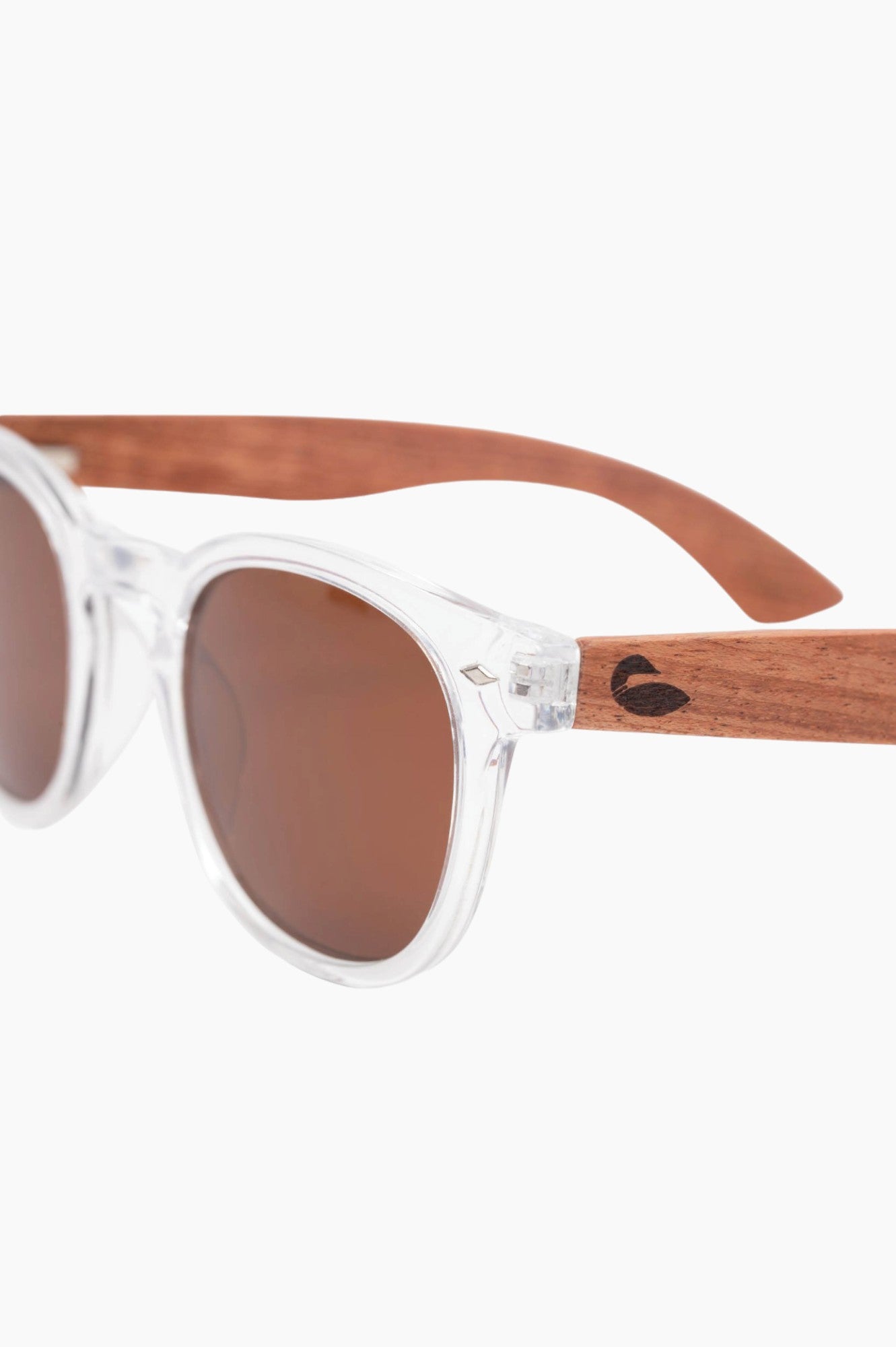 Clear sunglass frames with wood temple pieces with a loon on it.