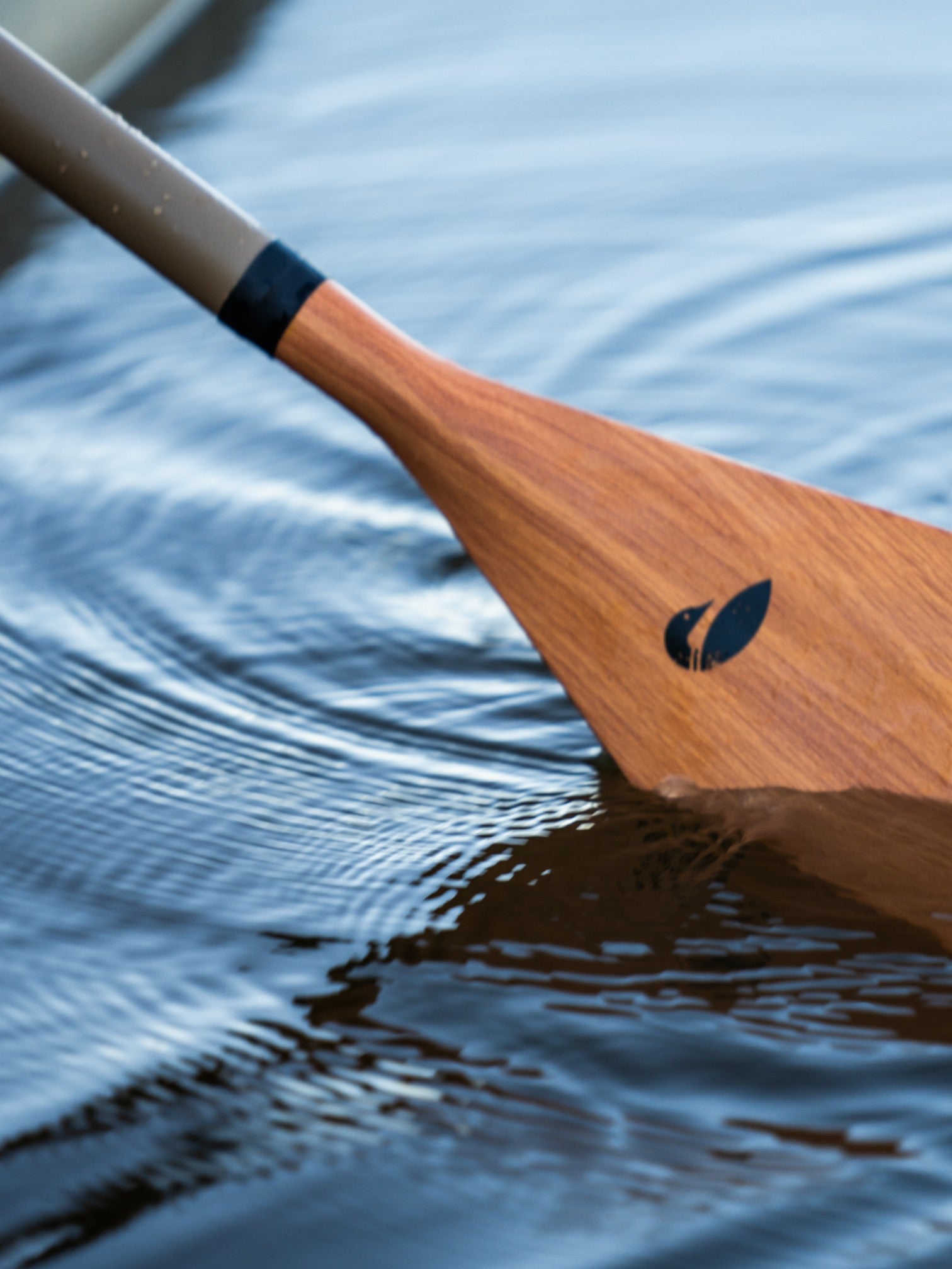 Bamboo paddle in the water.