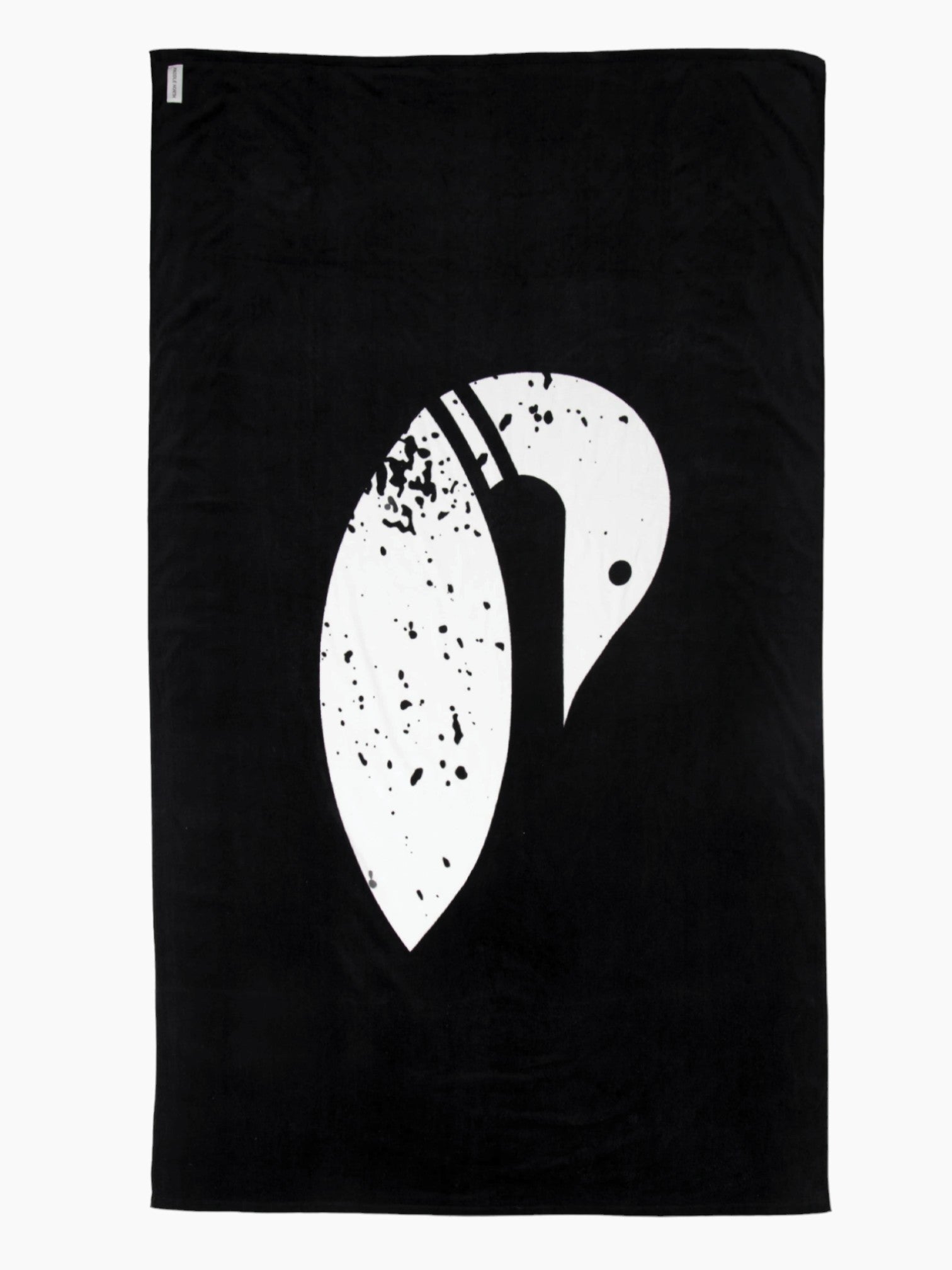 Lake accessories: black towel unrolled displaying the white paddle north loon logo on the front of it.