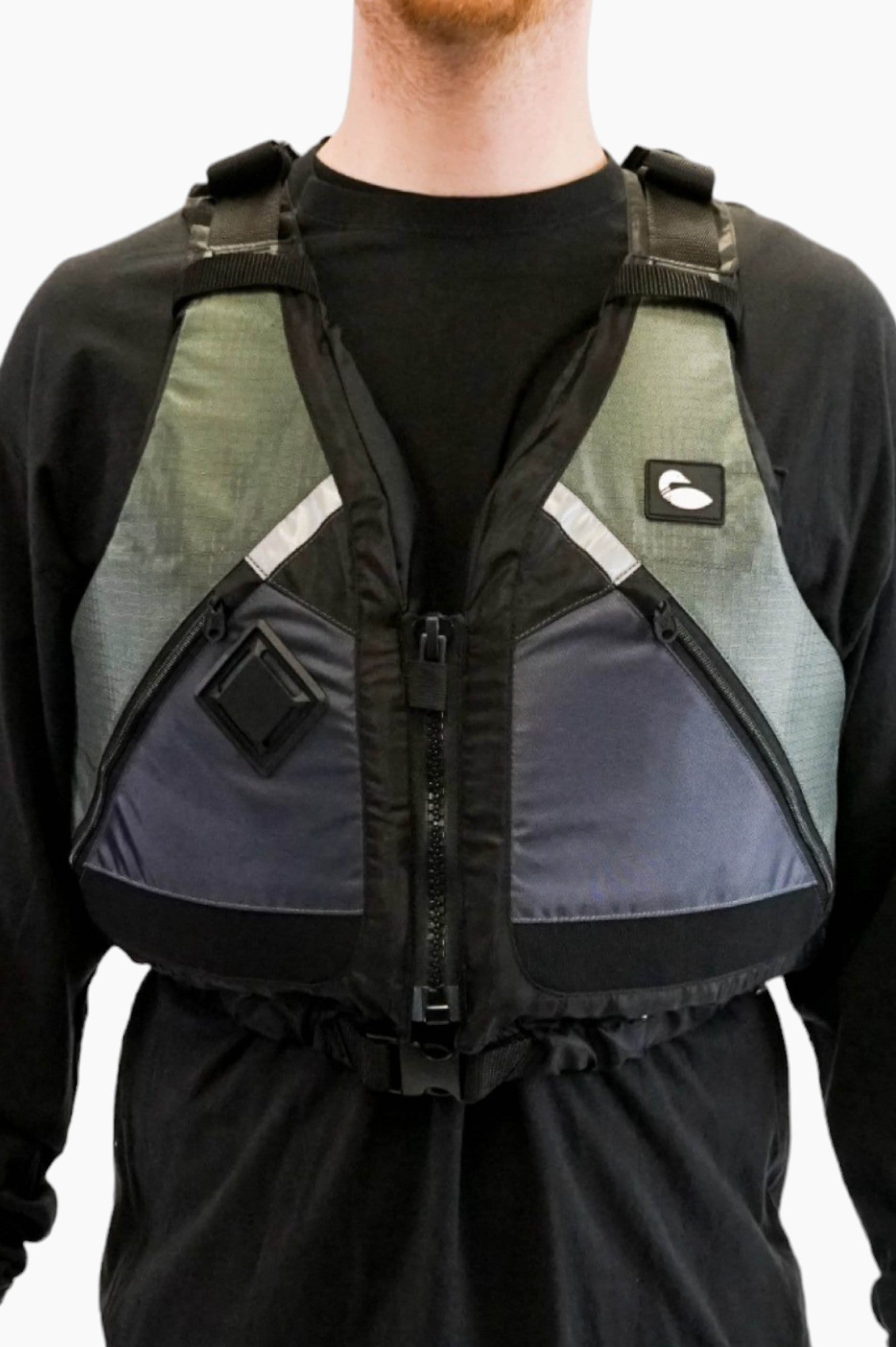 Person wearing a green and grey life vest with black zippers.
