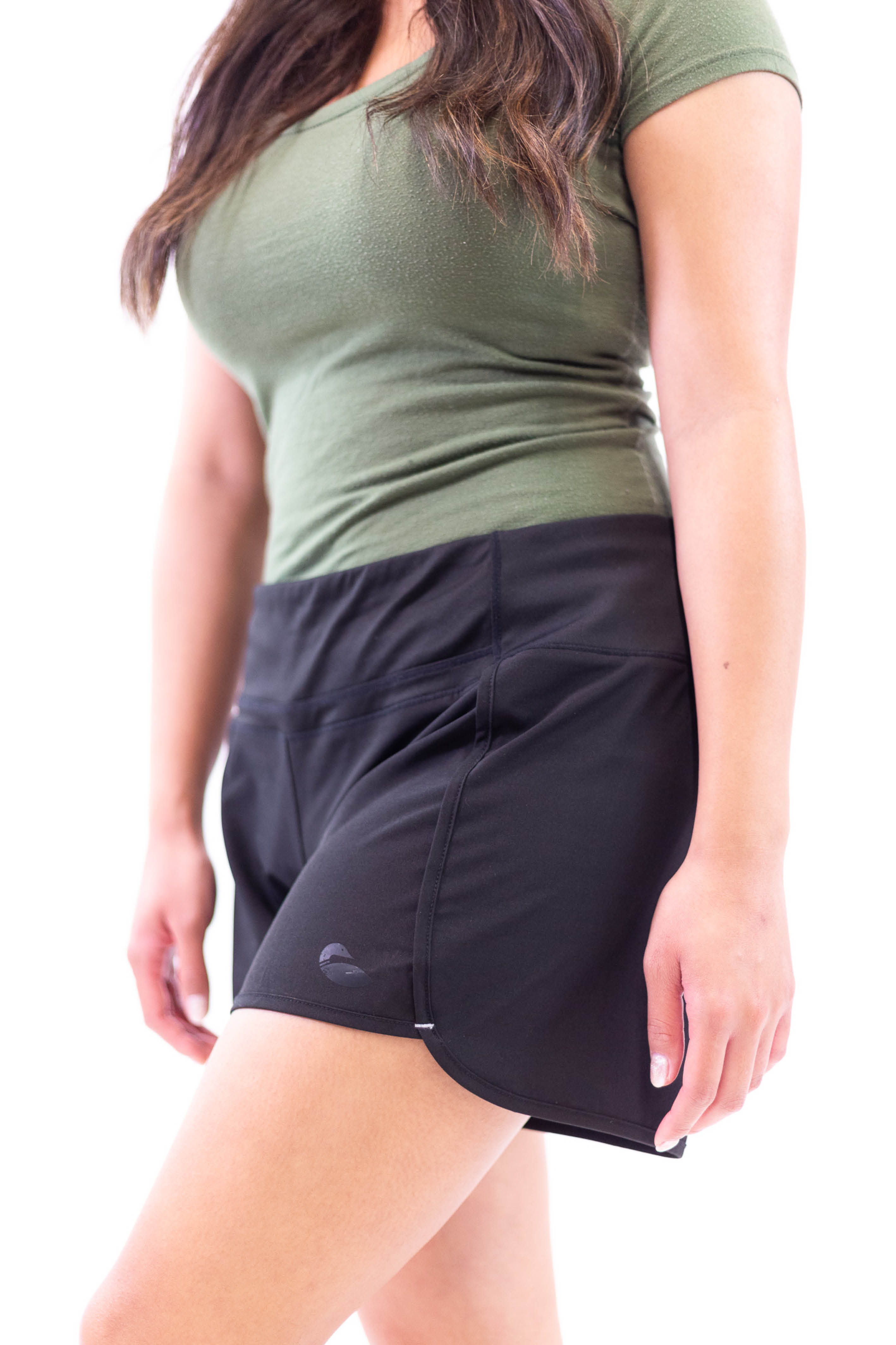 Studio photograph showing black athletic shorts.