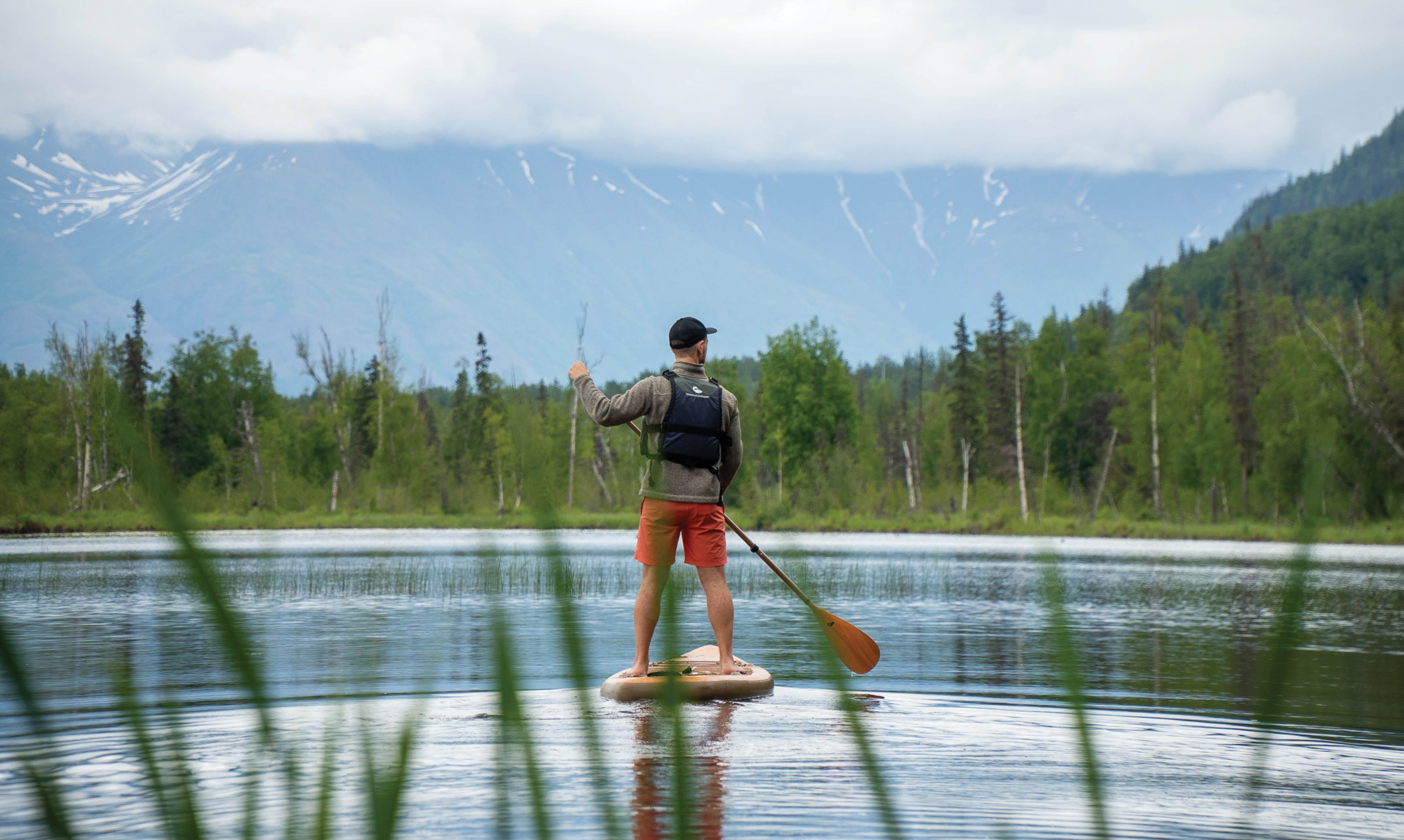 Inflatable paddle board on water in Alaska