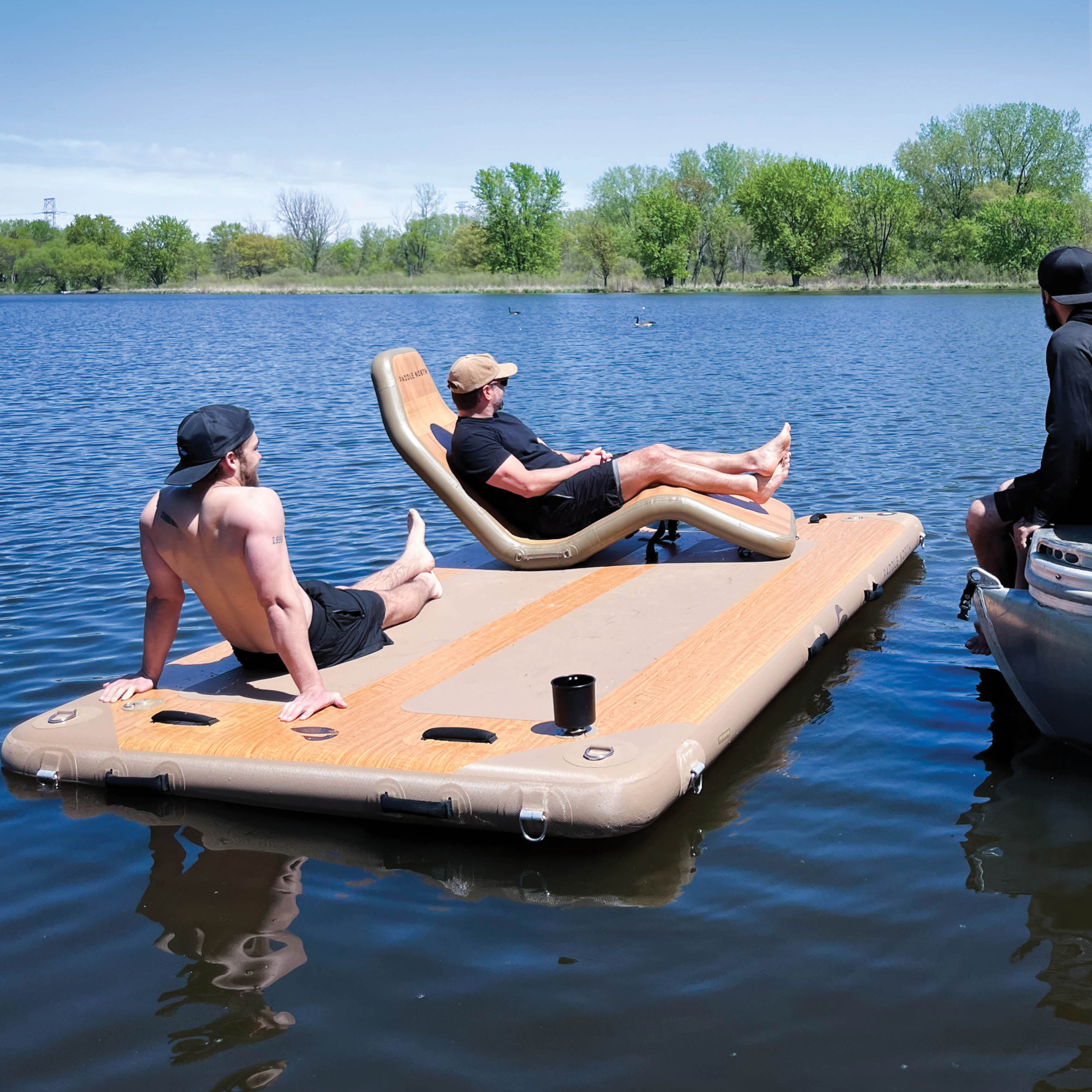 inflatable dock floating next to a pontoon boat