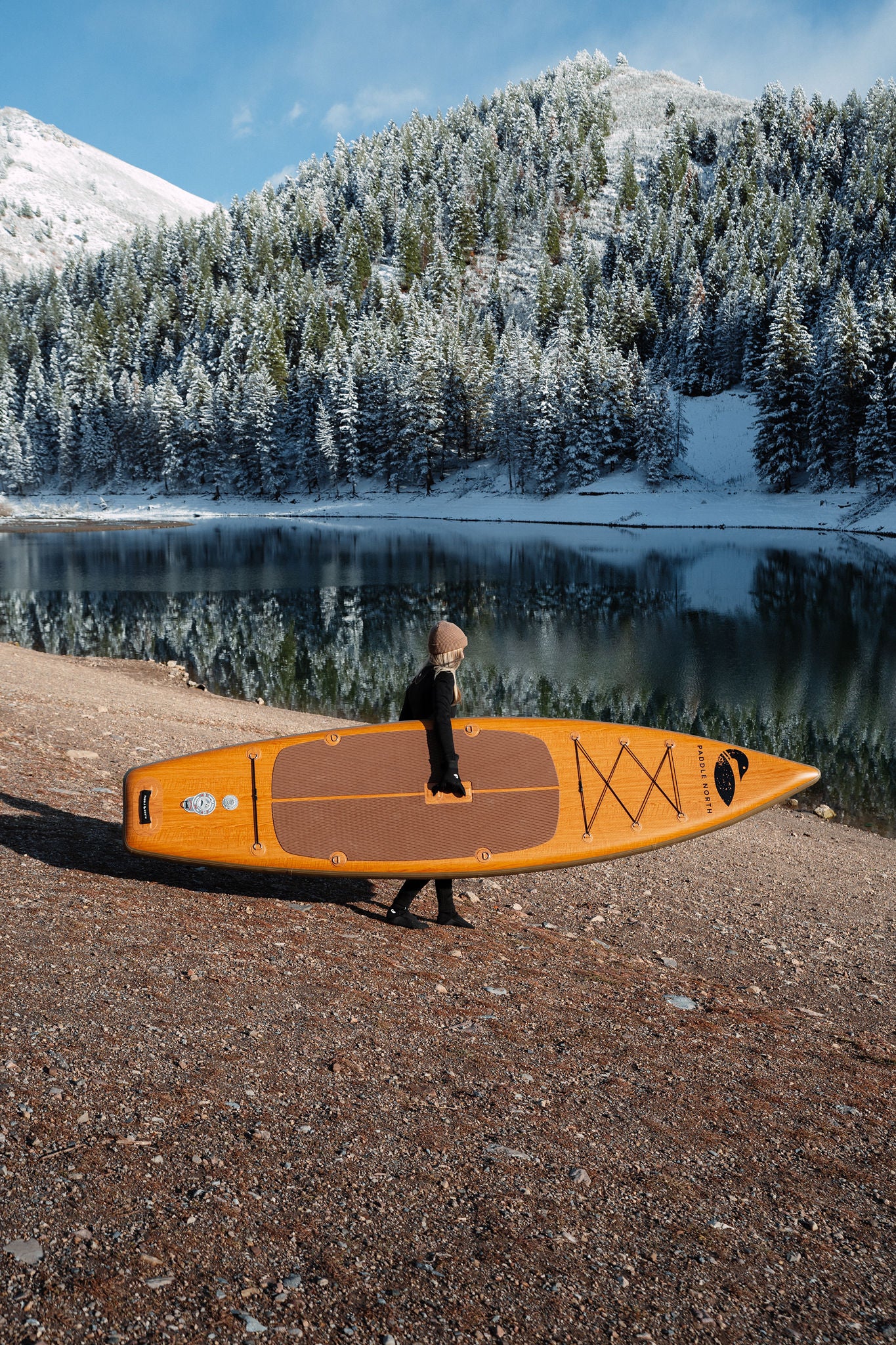 Portager inflatable paddle board being transported to a lake in Utah during the winter